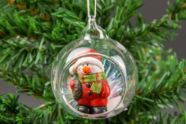 Glaskugel mit Öffnung und Weihnachtsdeko Figur Schneemann